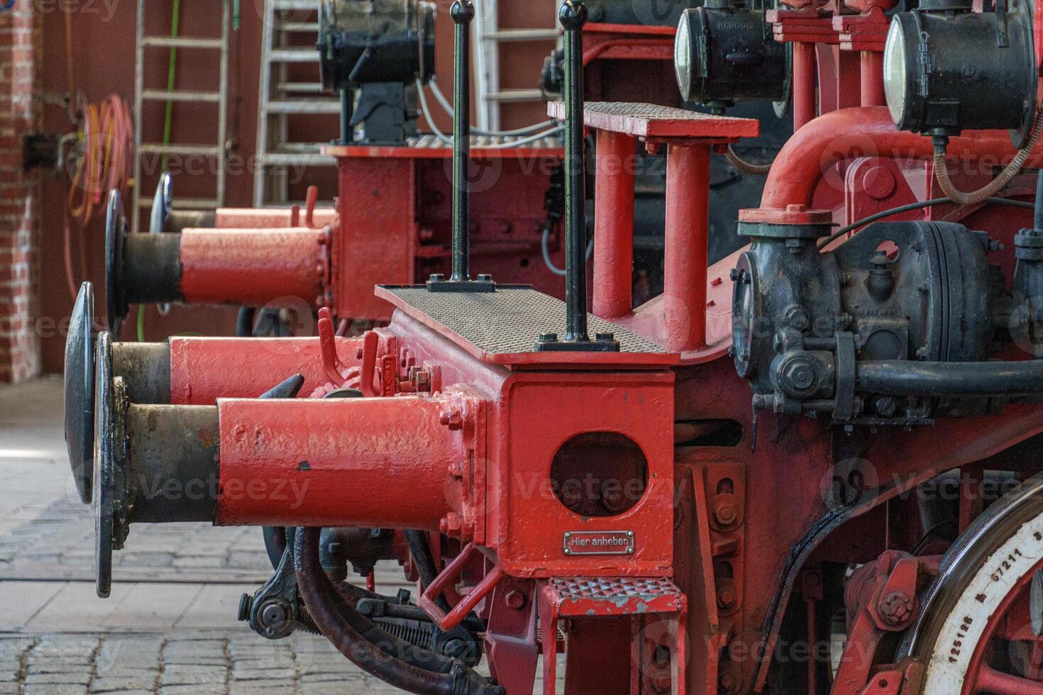 A close up of a red steam engine photo