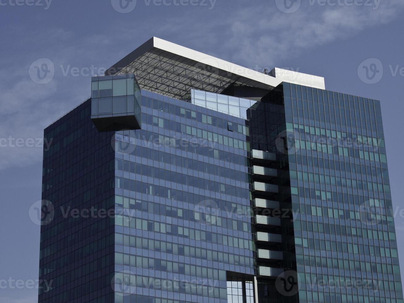 A tall building with windows in vienna photo