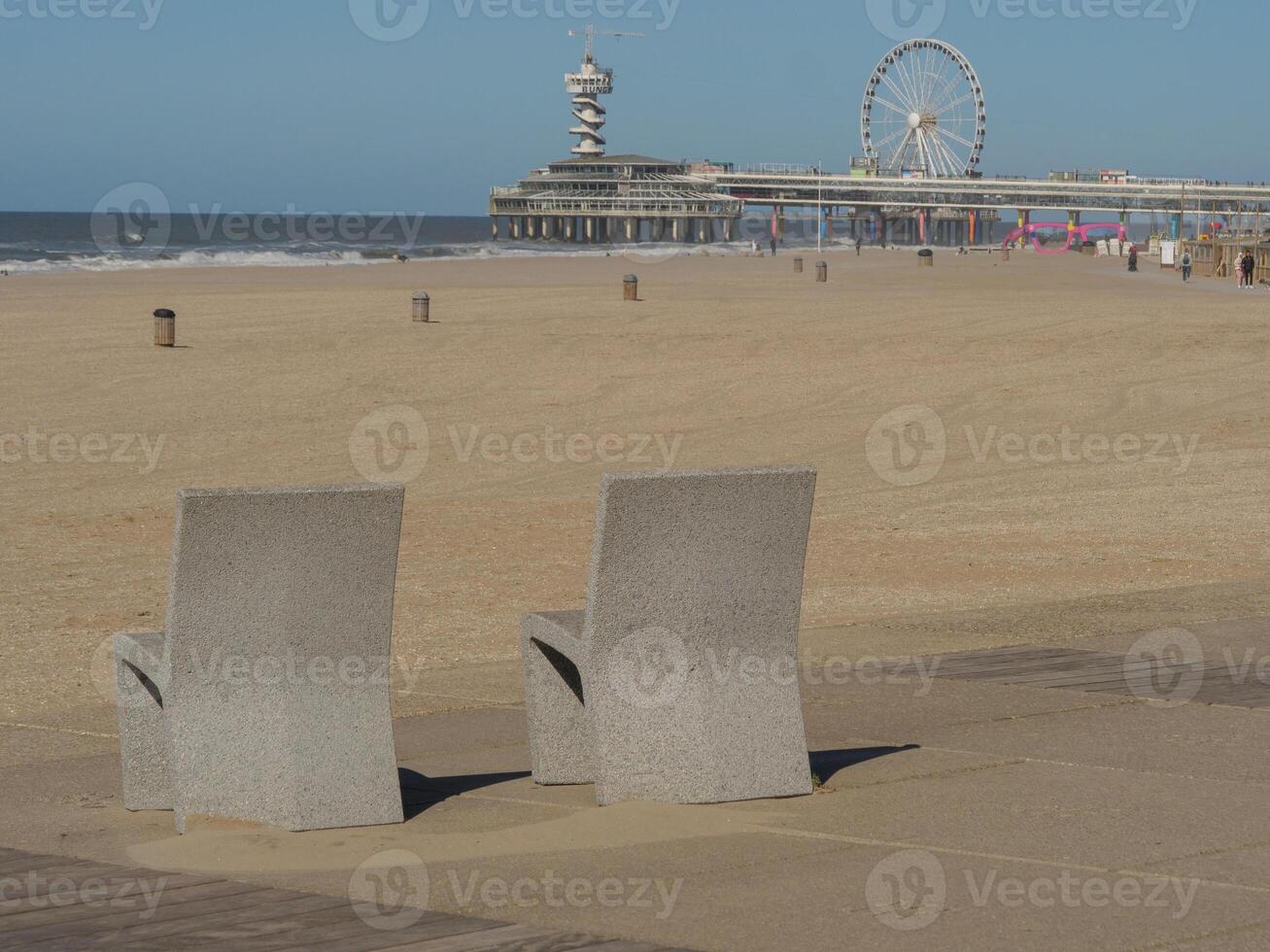 Two grey concrete chairs photo