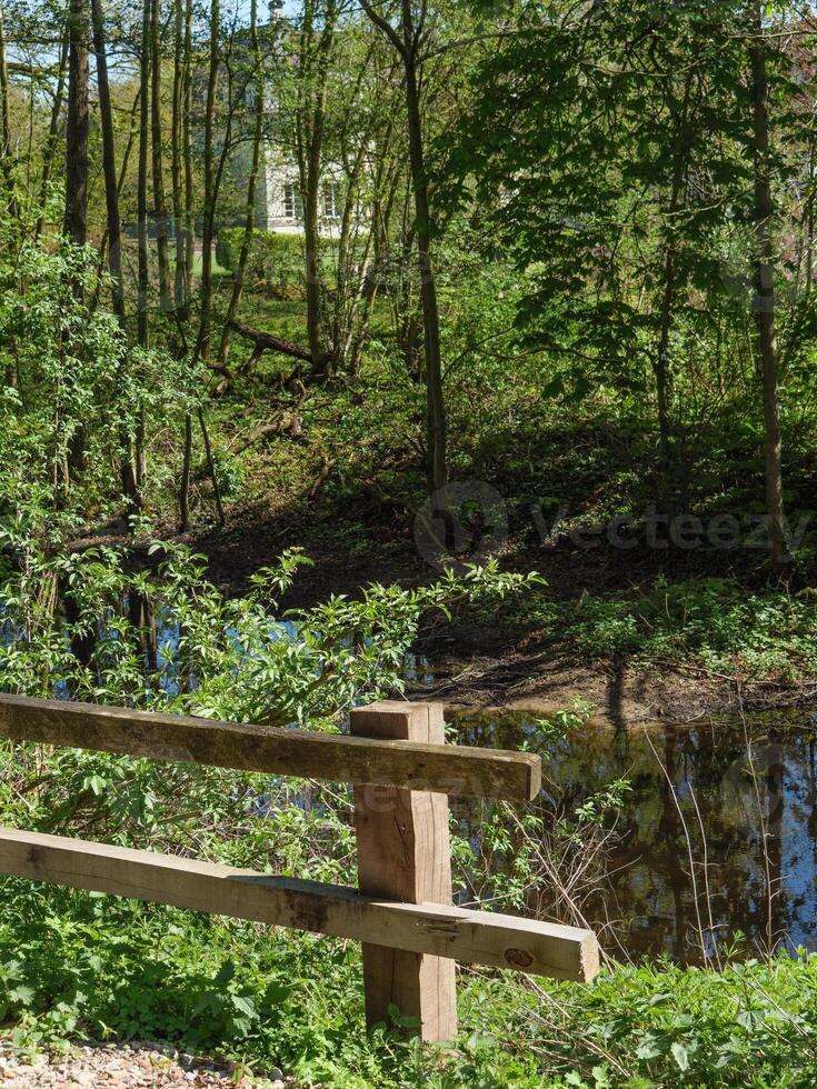 A wooden fence at a pond photo