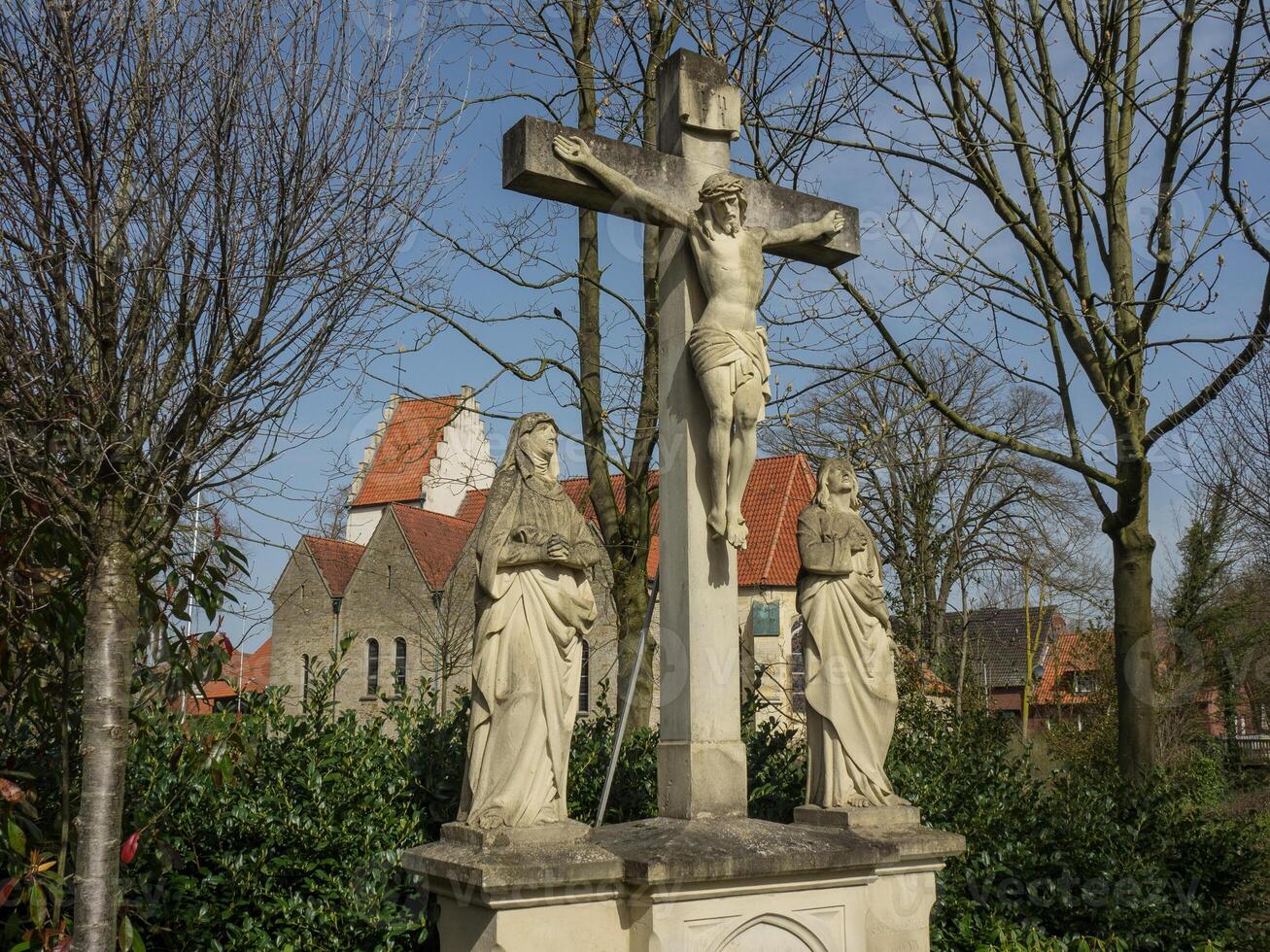 A statue of jesus on a cross in westphalia photo