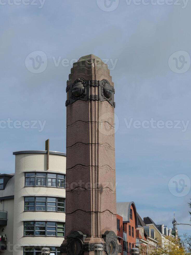 A large building with a clock tower in nijmegen photo