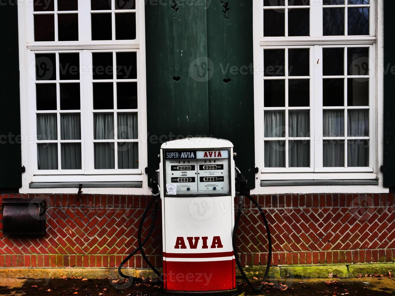 A red and white gas pump photo