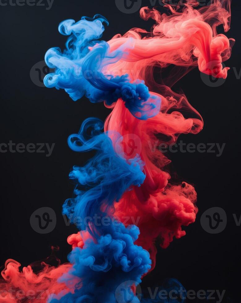 Vibrant swirls of red and blue smoke on black background photo