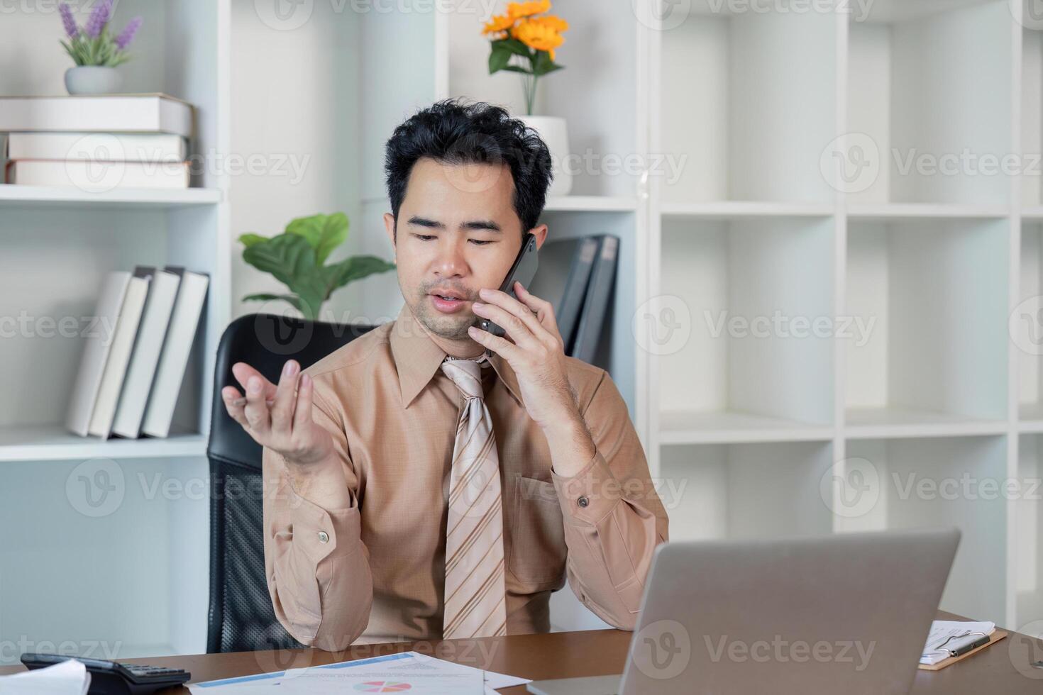 Businessman negotiating on a phone call in a contemporary office, demonstrating effective communication skills photo