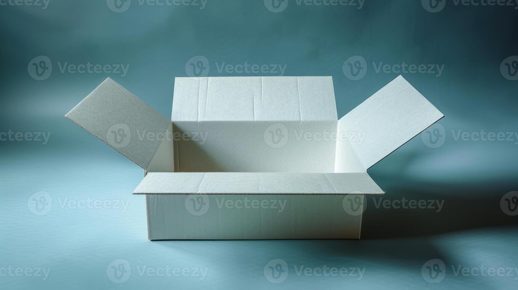 A white cardboard box with its flaps open, sitting on a light blue background photo