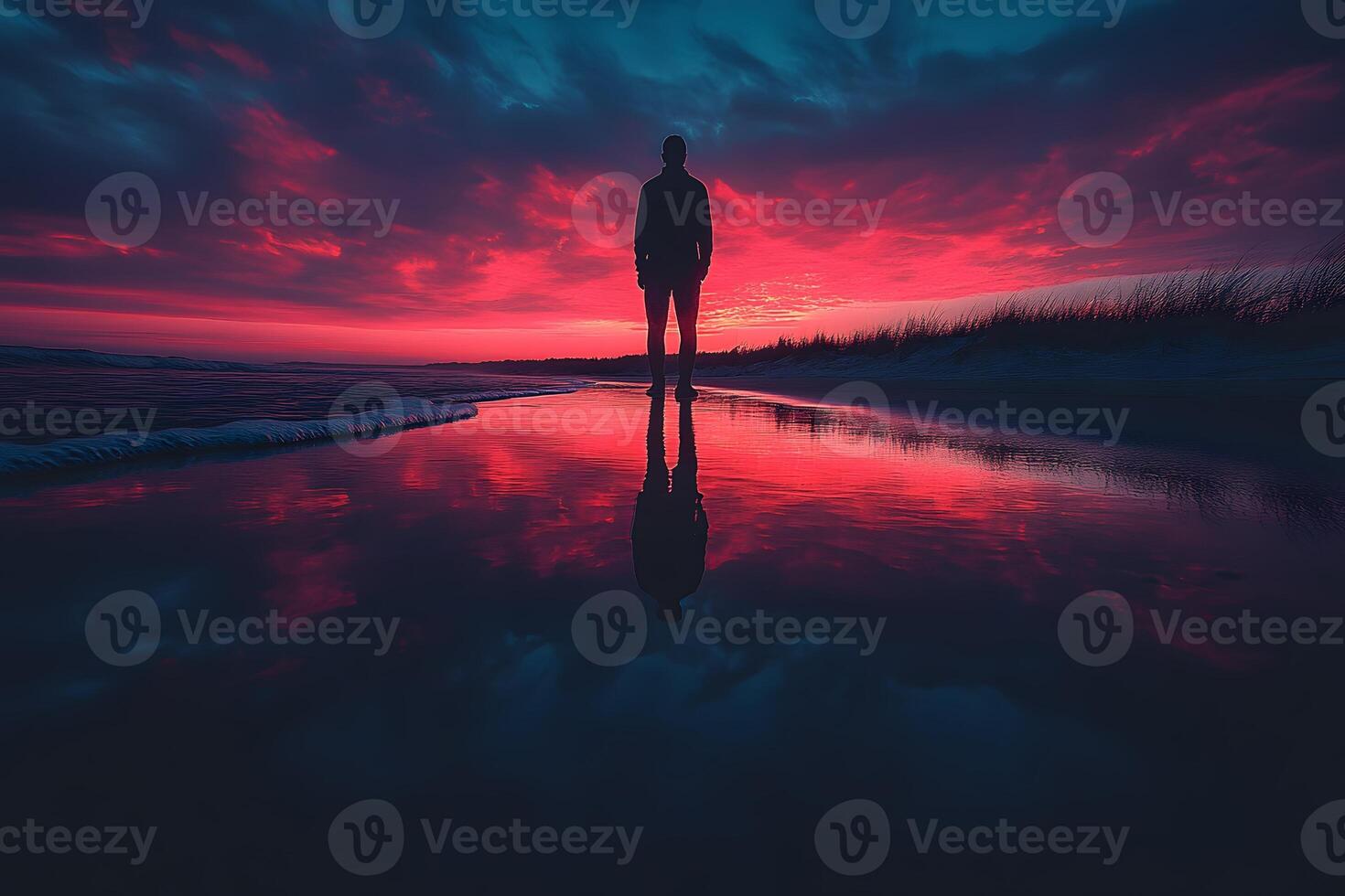 Silhouette of a Person at Sunset on a Beach with Reflective Waters - Tranquil Evening Scene for Meditation and Relaxation photo