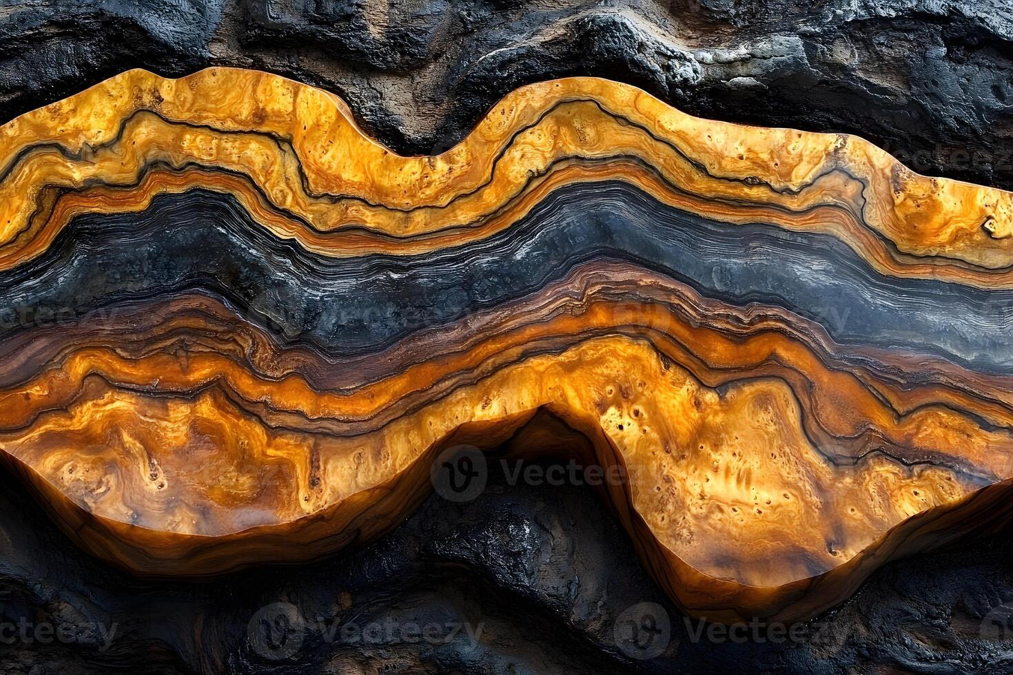 Abstract Geode Pattern with Vibrant Orange and Black Layers in Natural Rock Formation photo