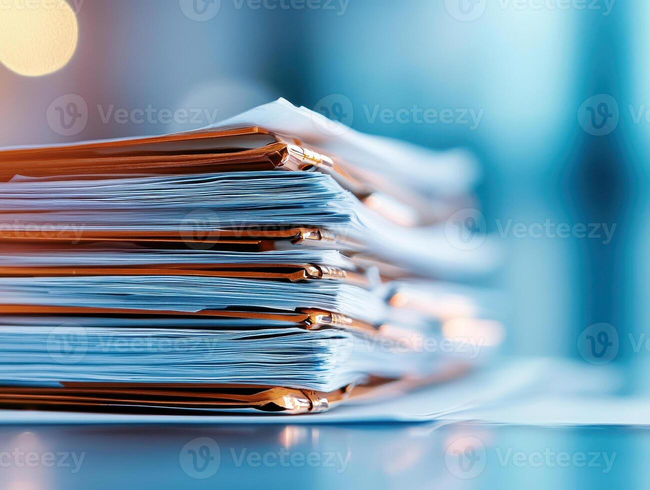 Stacked medical documents with orange folders, illuminated by soft light, create professional atmosphere. organized papers suggest efficiency and attention to detail photo