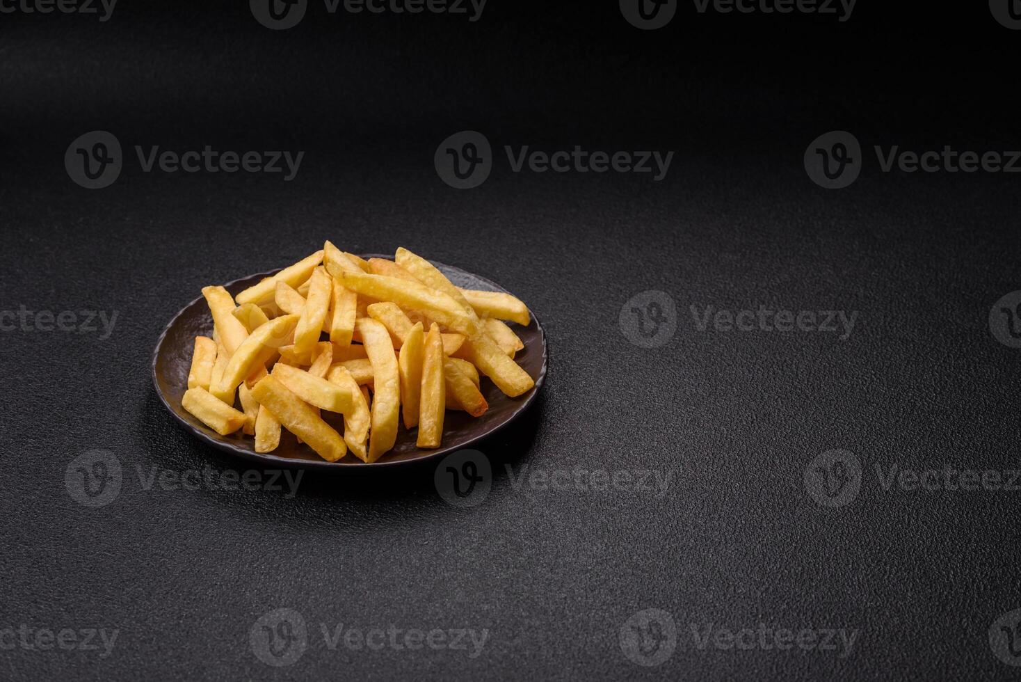 Delicious crispy French fries with salt and spices x photo