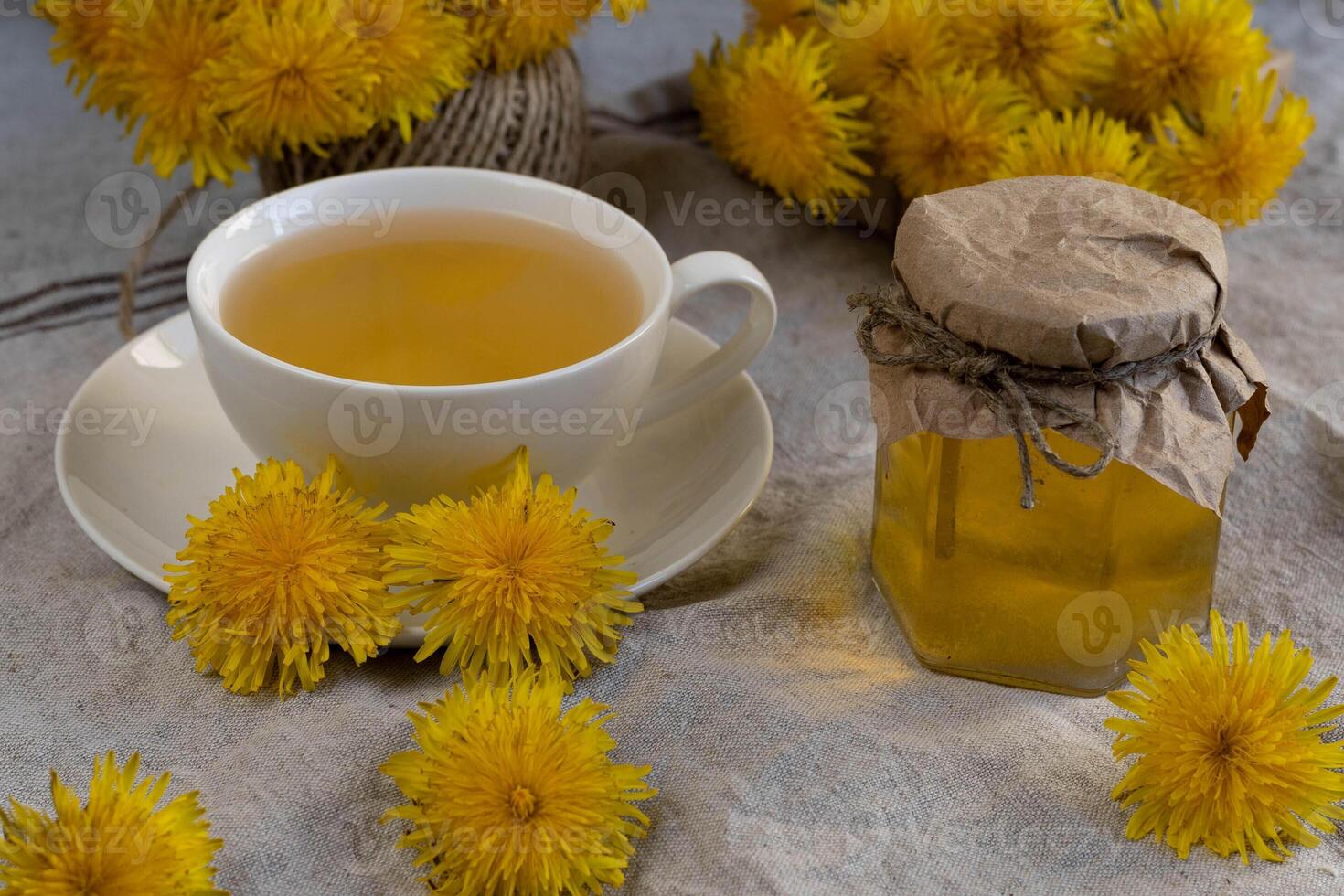 Yellow dandelion jam, still life of yellow flowers and gift boxes photo
