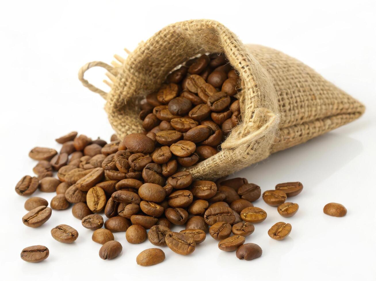 Freshly roasted coffee beans spilling from burlap sack, creating rich aroma photo