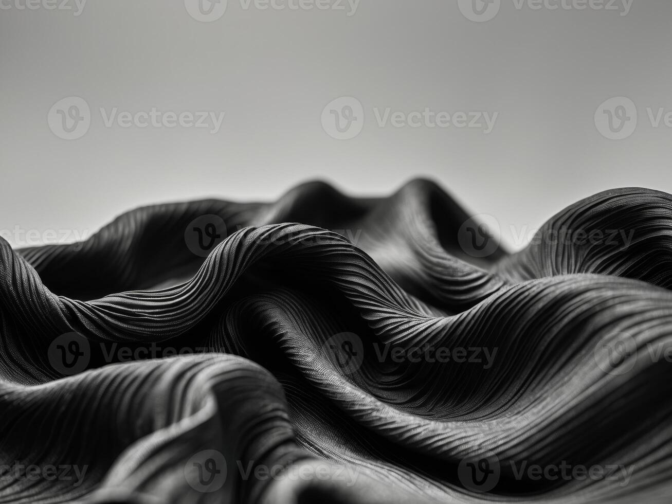 black fabric with ripples and folds wavy surface wallpaper. photo