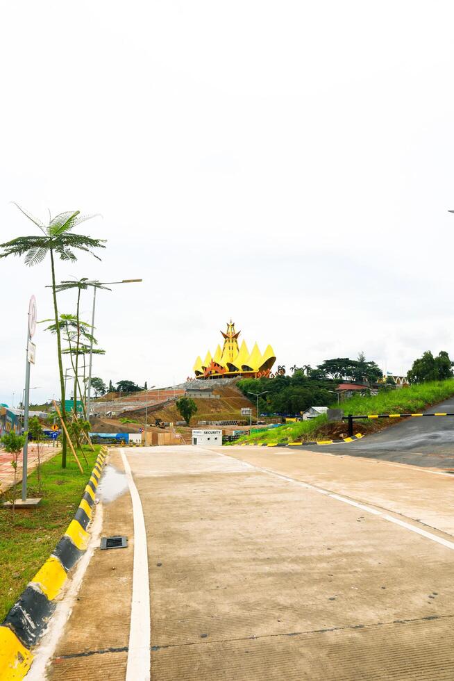 Bakauheni, January 17, 2025, View of golden building from road with yellow and black markings photo