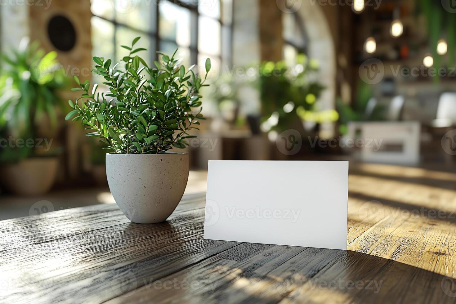 Business card mockup on a sleek table surrounded by contemporary office elements in a well-lit workspace. photo