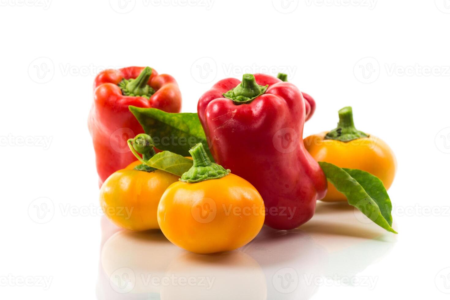 red and yellow sweet peppers. isolated on white background photo
