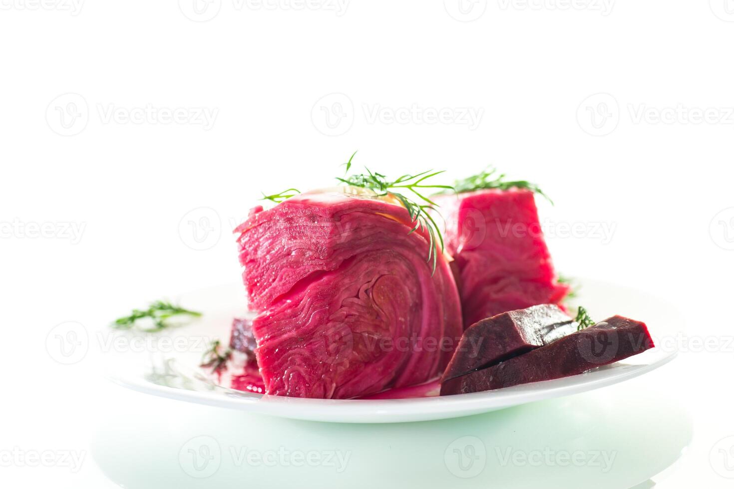 Vegetarian food. pickled cabbage with beets and carrots, in a plate, isolated on white background photo