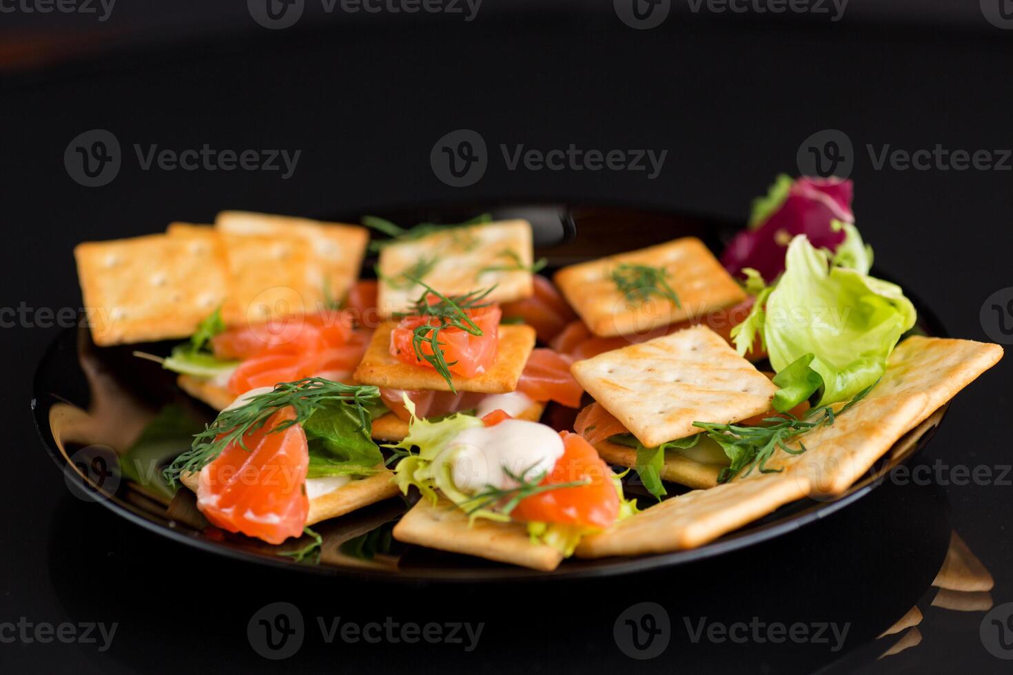 crackers with lightly salted red fish photo