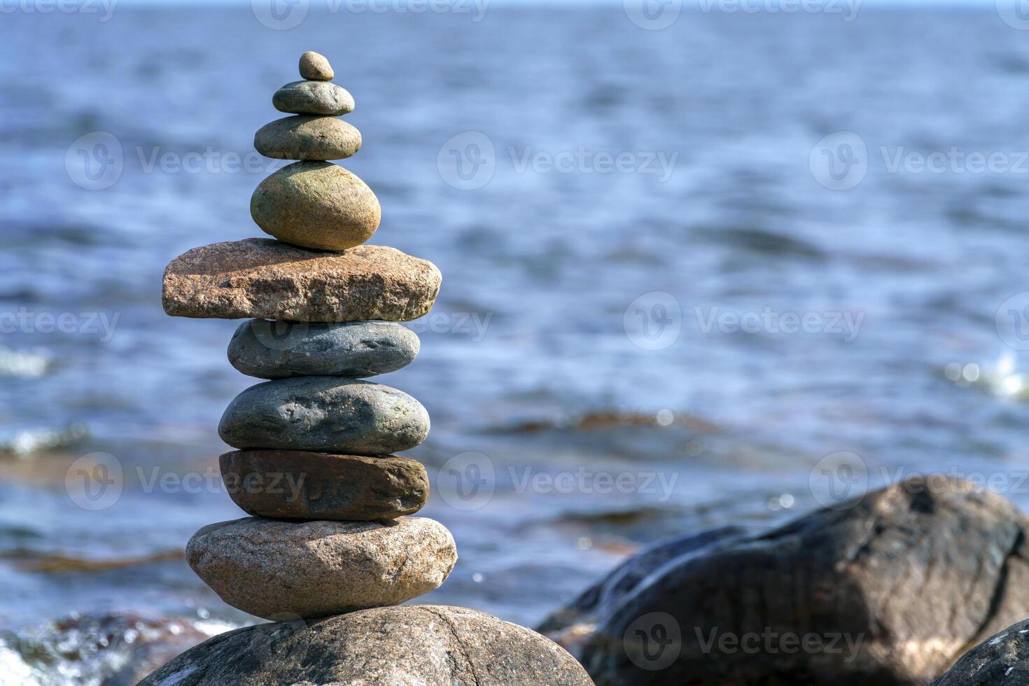 Pyramid of stones. Unstable balance of objects. photo