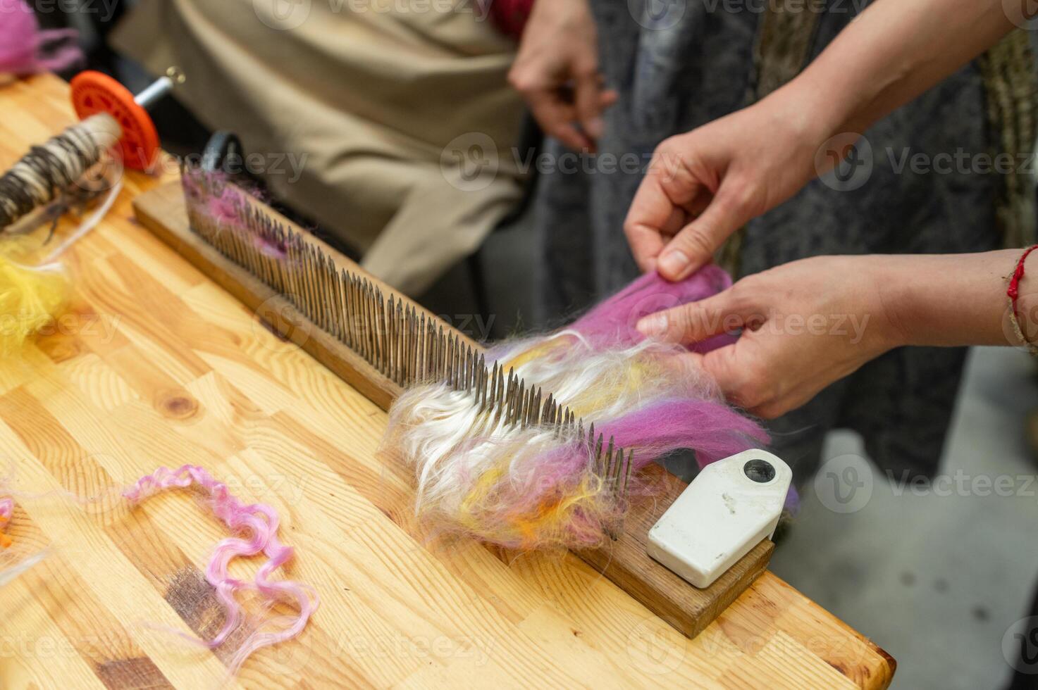 Crafting creativity female hands prepare colorful wool for fiber art creation photo