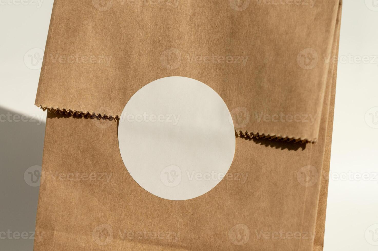 Plain brown paper bag with circular label photo