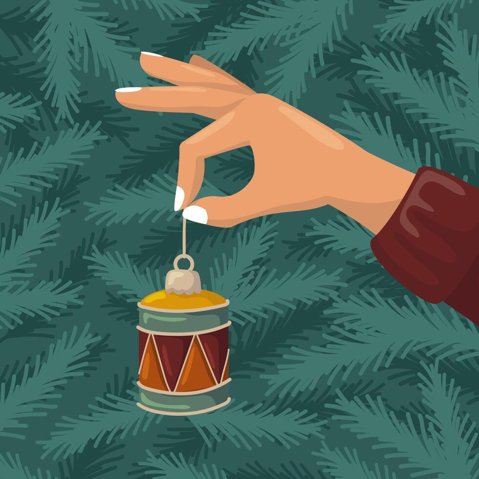 A hand holding a Christmas drum ornament. background with fir branches. Holiday preparation. vector