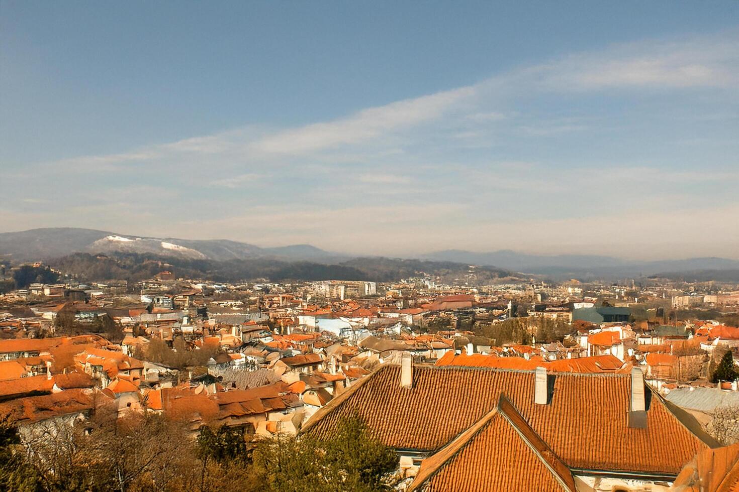 Cityscape panoramic view, mountains background, autumn photo