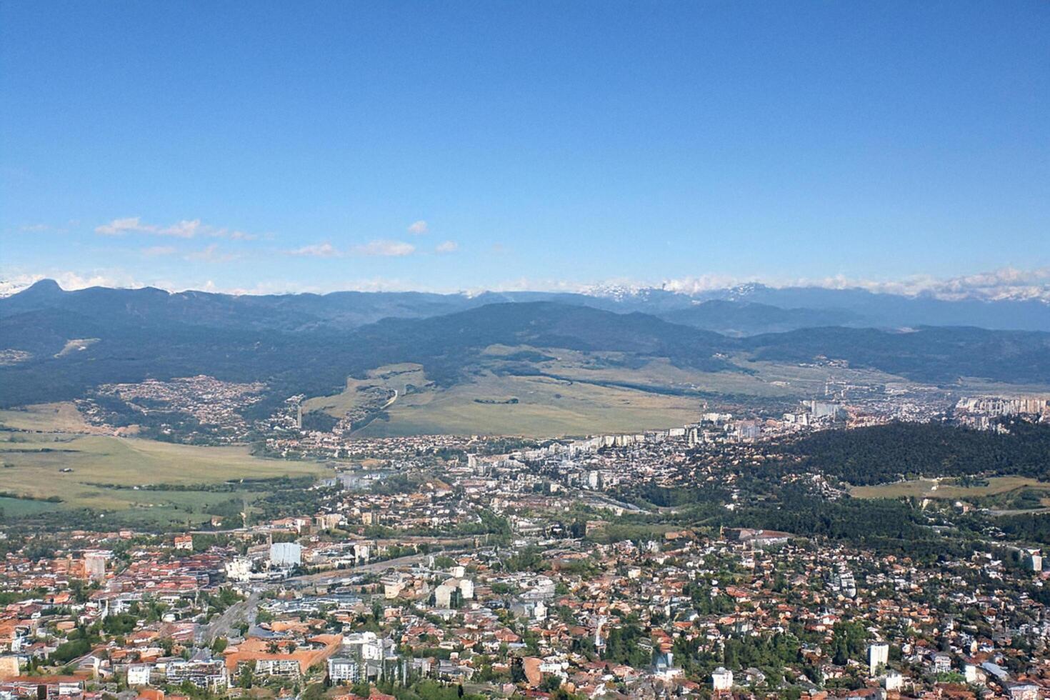 Mountainous city aerial view, summer landscape photo