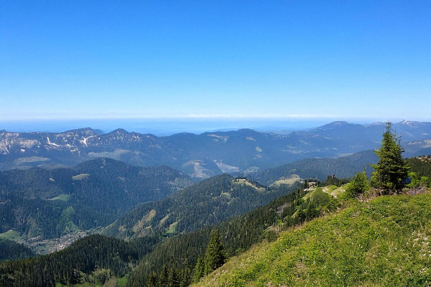 Mountaintop panorama distant sea, valley, hiking photo