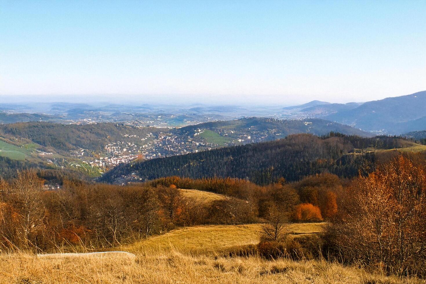 Autumn mountain vista, valley town below, scenic landscape photo