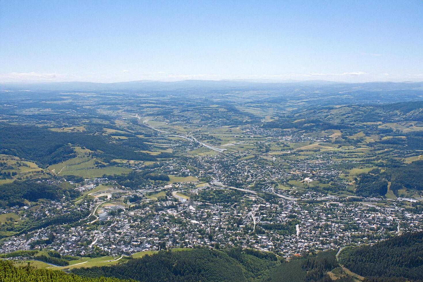 Mountaintop view valley town, clear sky, summer landscape photo