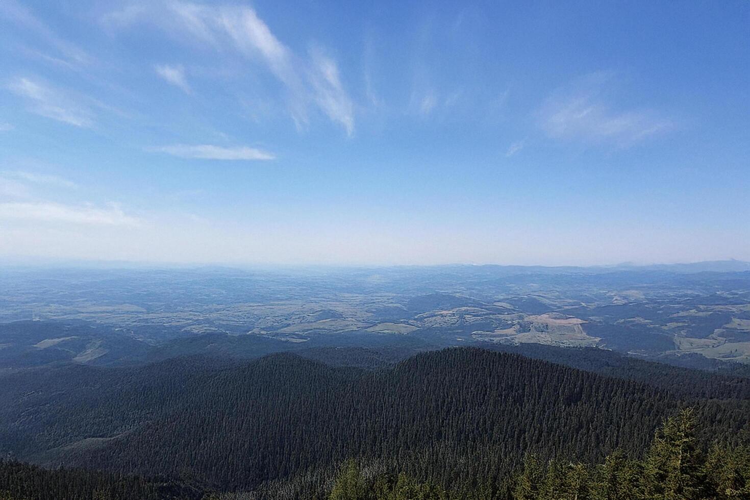 Mountaintop panorama scenic view, vast landscape, blue sky, summer photo