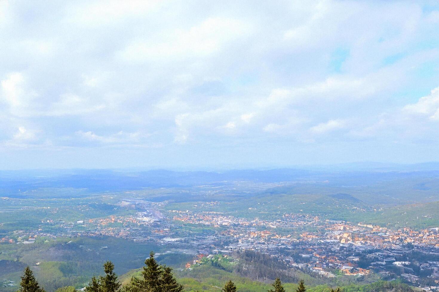 Mountaintop view City panorama, hills, clouds photo