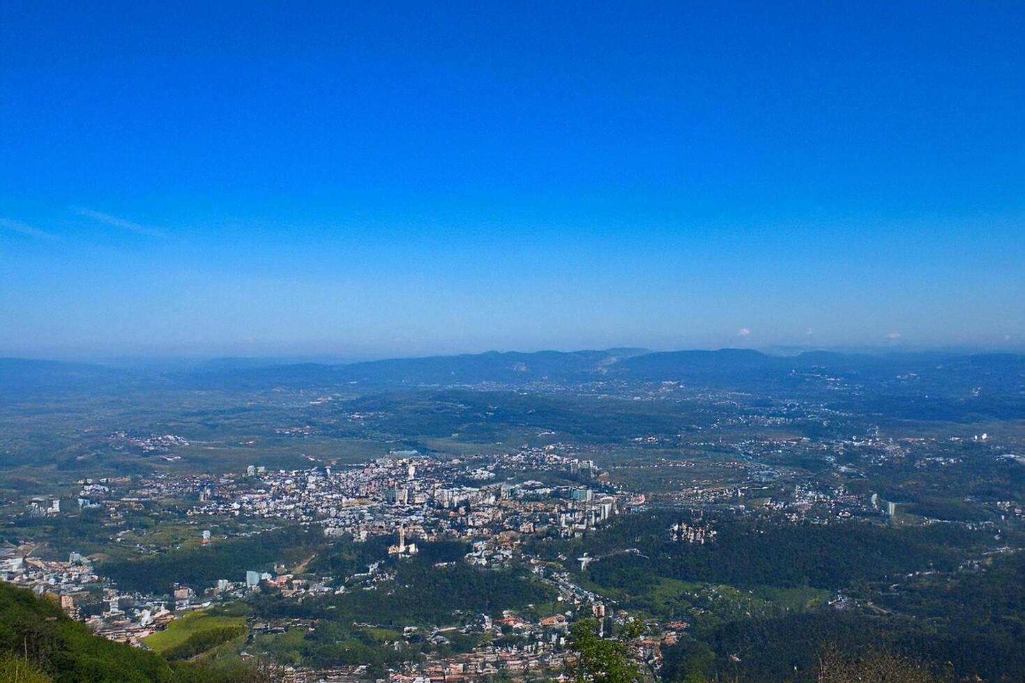 Mountaintop City View Panoramic landscape, clear sky, valley vista photo