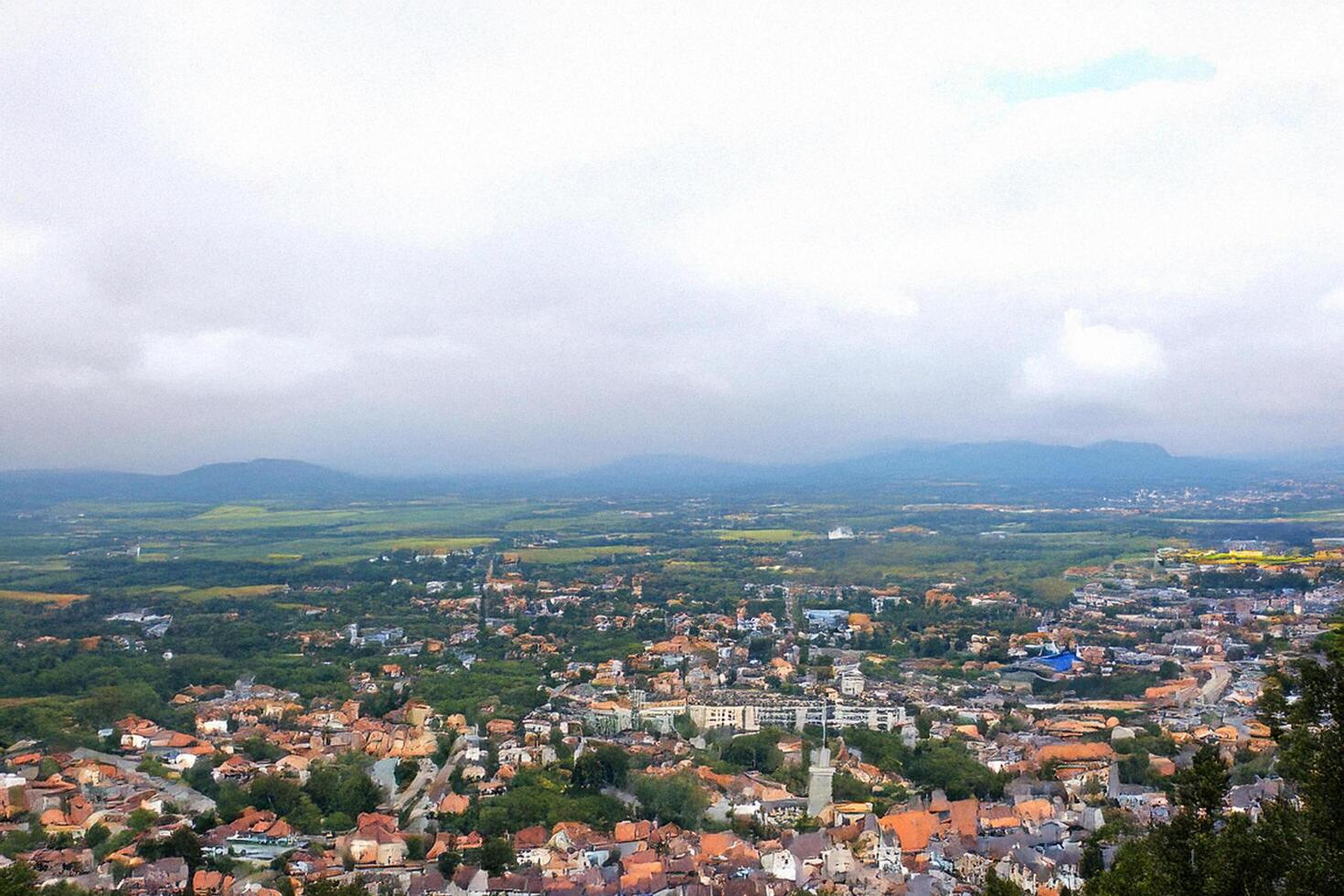 Hilltop view Town, valley, mountains, cloudy sky, travel photo