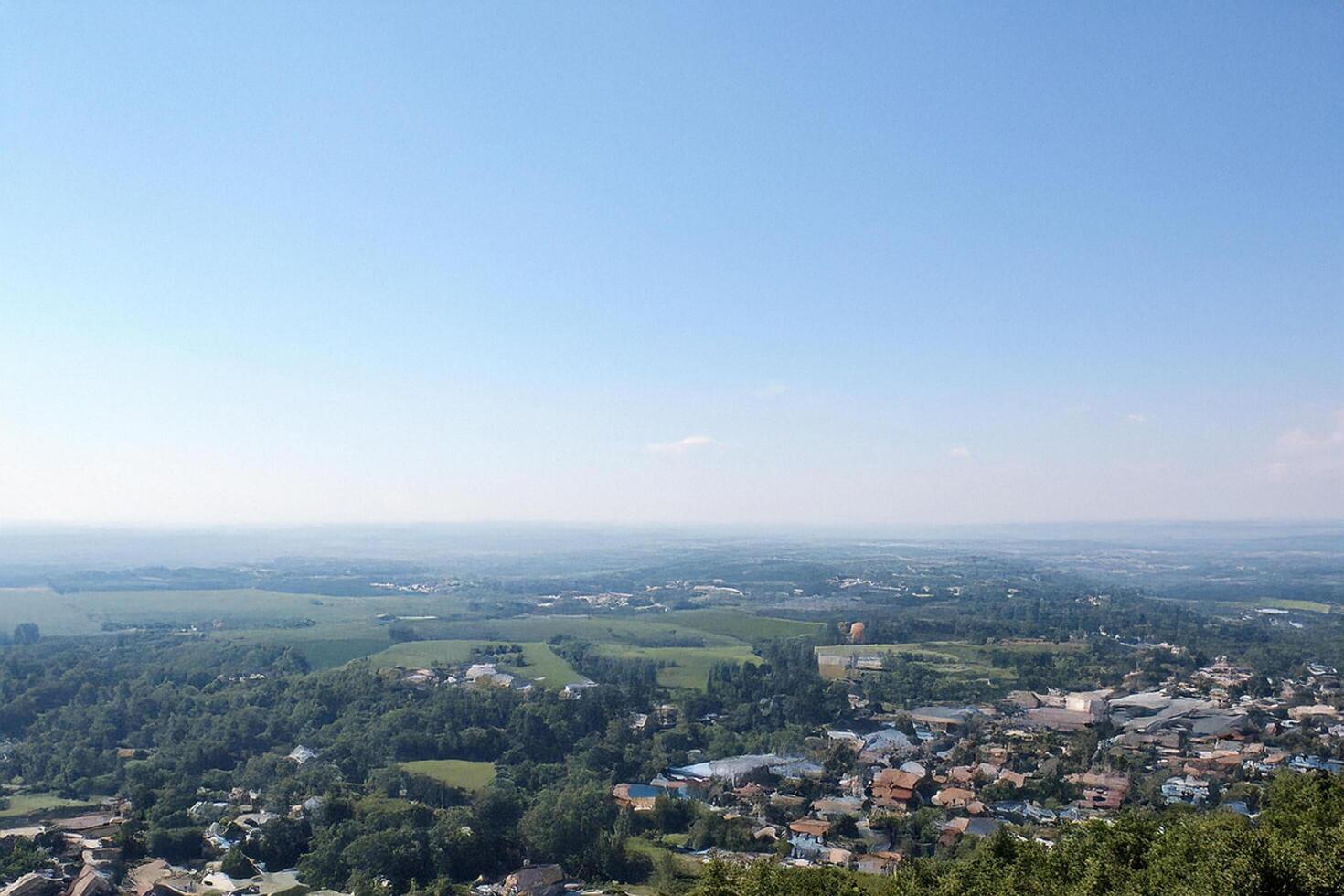 Hilltop view Rural landscape, town panorama, clear sky, summer day photo