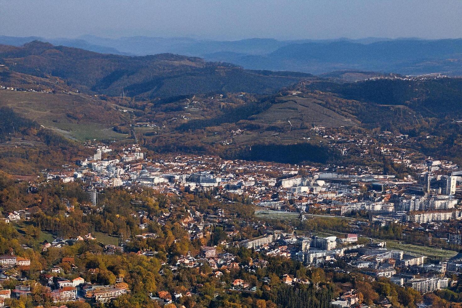 Aerial autumn view valley town, hills background photo