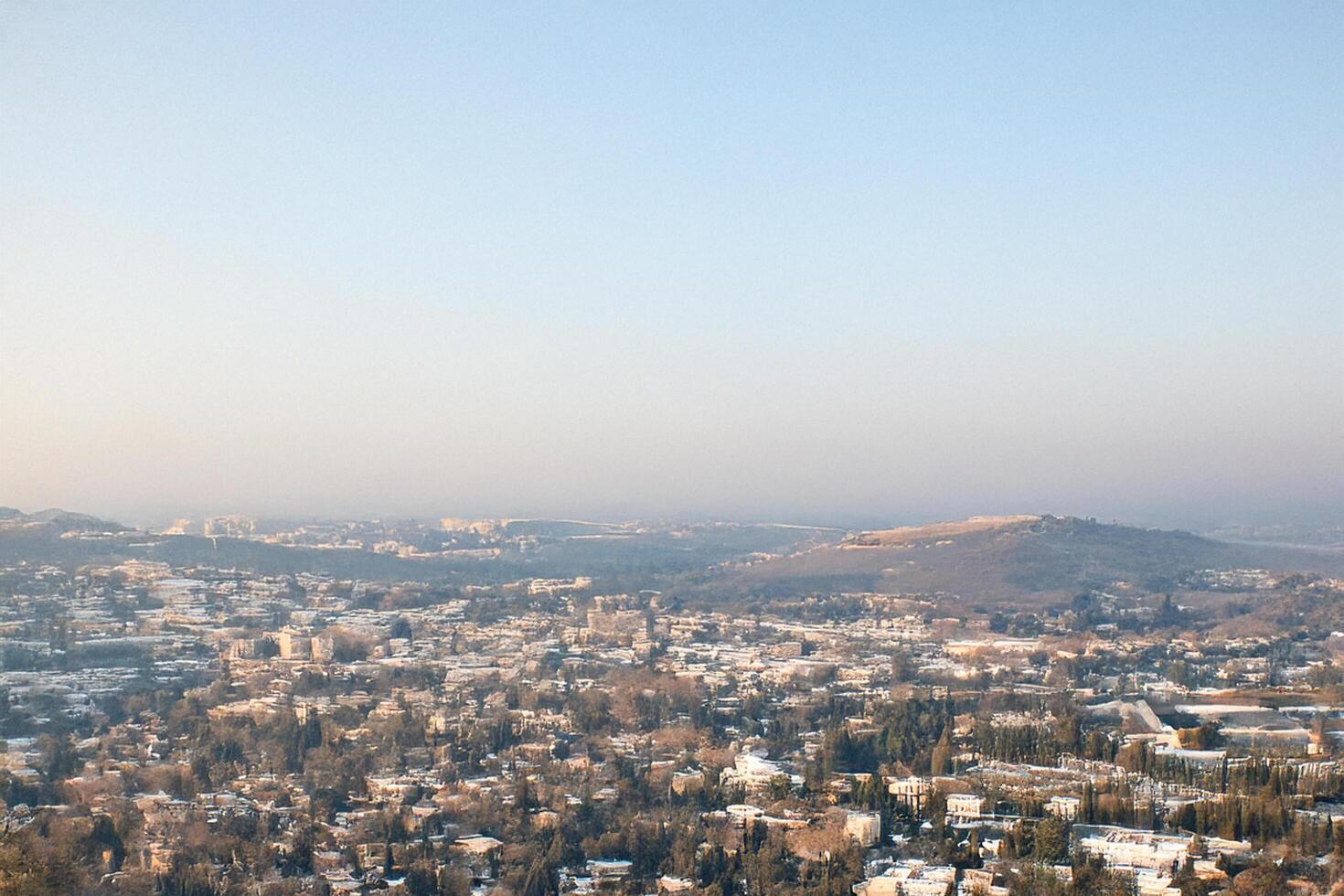 Cityscape panorama, winter view, hills, snow, aerial photo