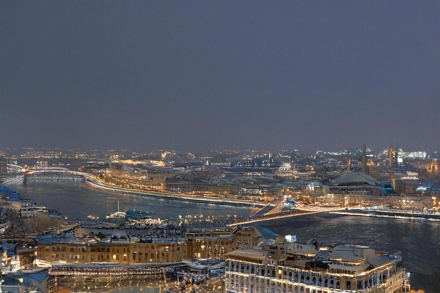 Night city panorama, snowy river, bridge, lights photo
