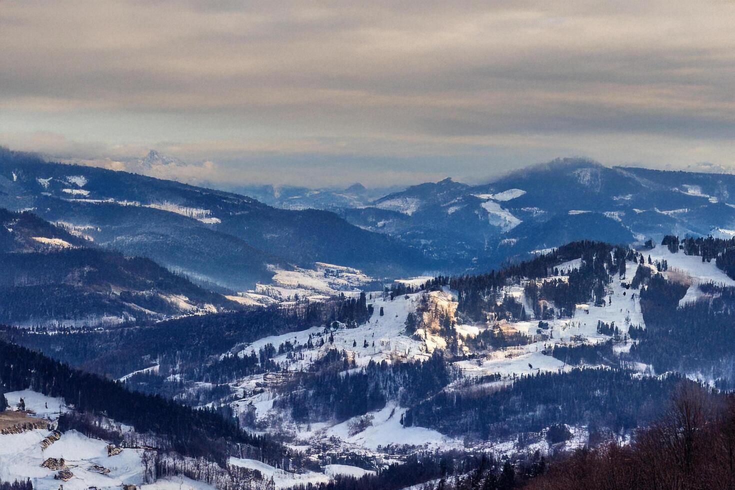 Snowy mountain valley panorama, winter landscape, travel postcard photo