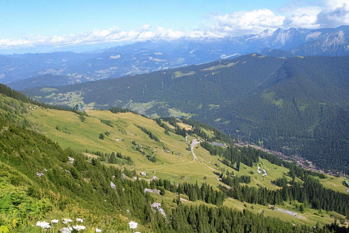 Mountaintop scenic view Alpine road, valley, summer photo