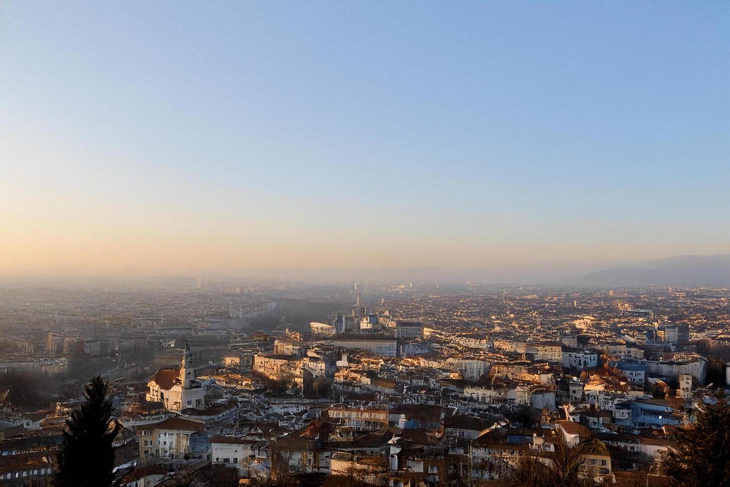 Cityscape sunrise panorama, hazy hills, urban view photo