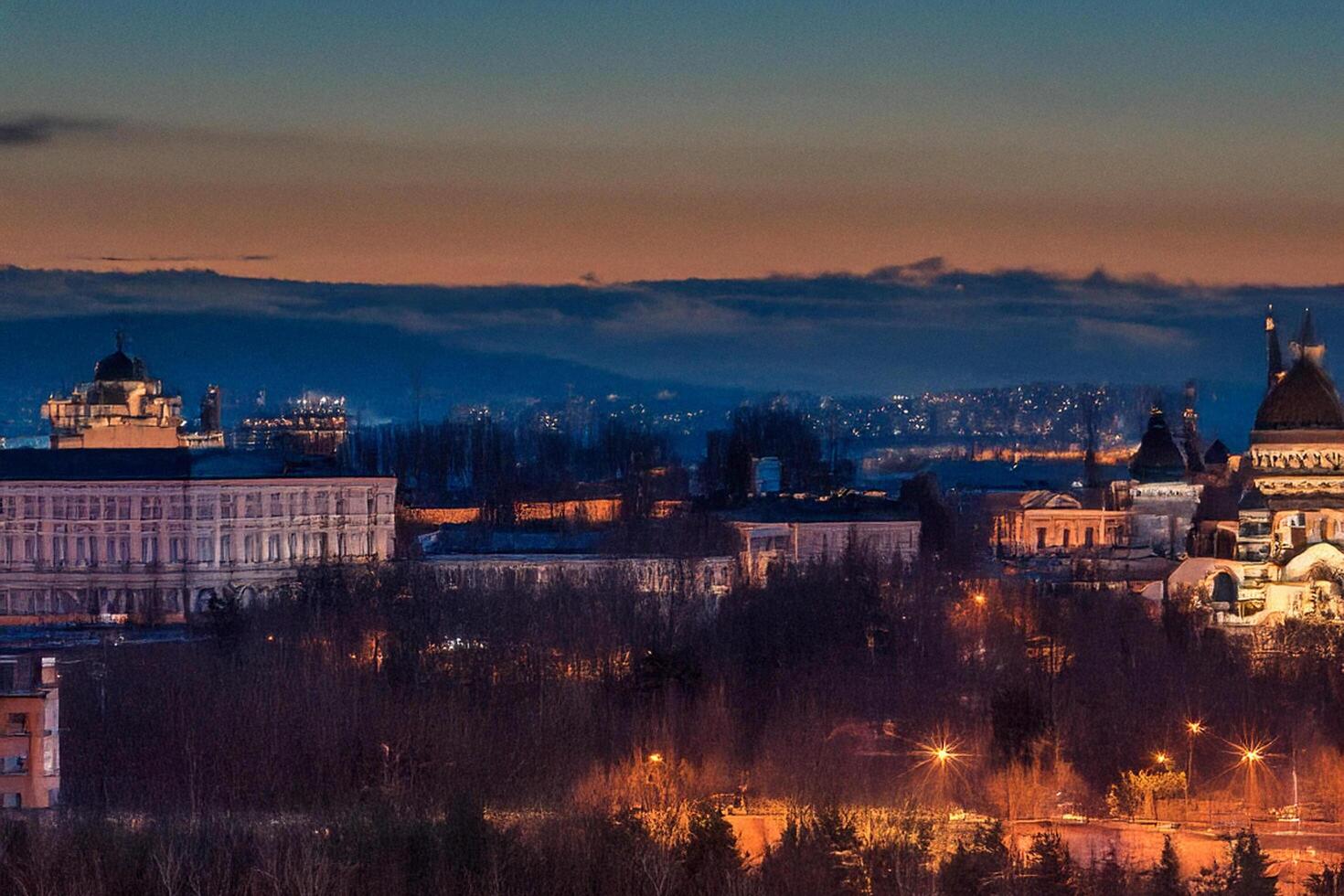 Cityscape twilight panorama, buildings, hills, lights photo