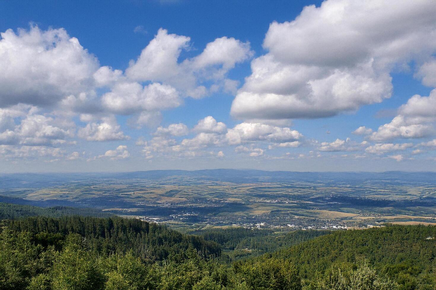 Hilltop summer landscape, valley view, puffy clouds photo