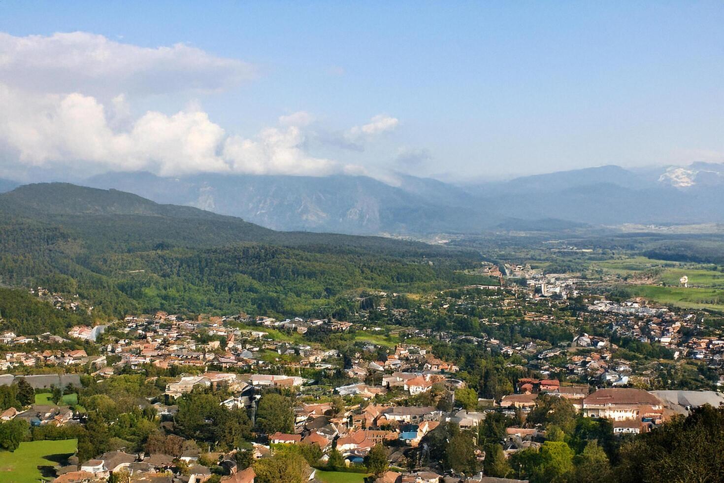 Mountain village aerial view, valley, sunny day photo