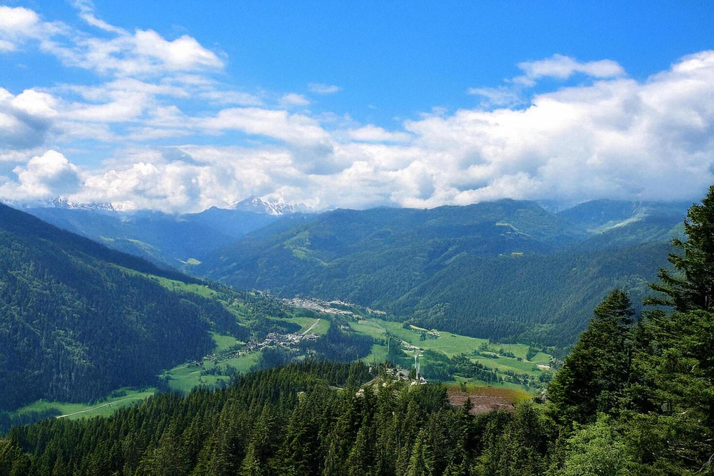 Mountain valley panorama, scenic view, summer clouds, alpine landscape, travel poster photo