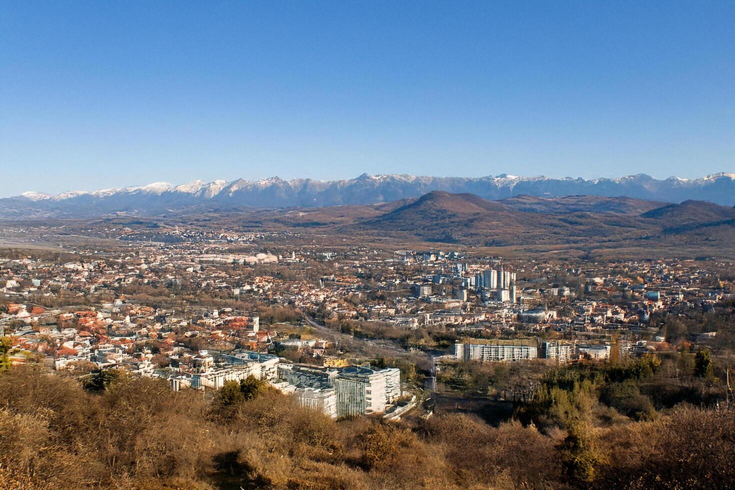 Cityscape panorama, mountain view, autumn, sunny day, travel brochure photo