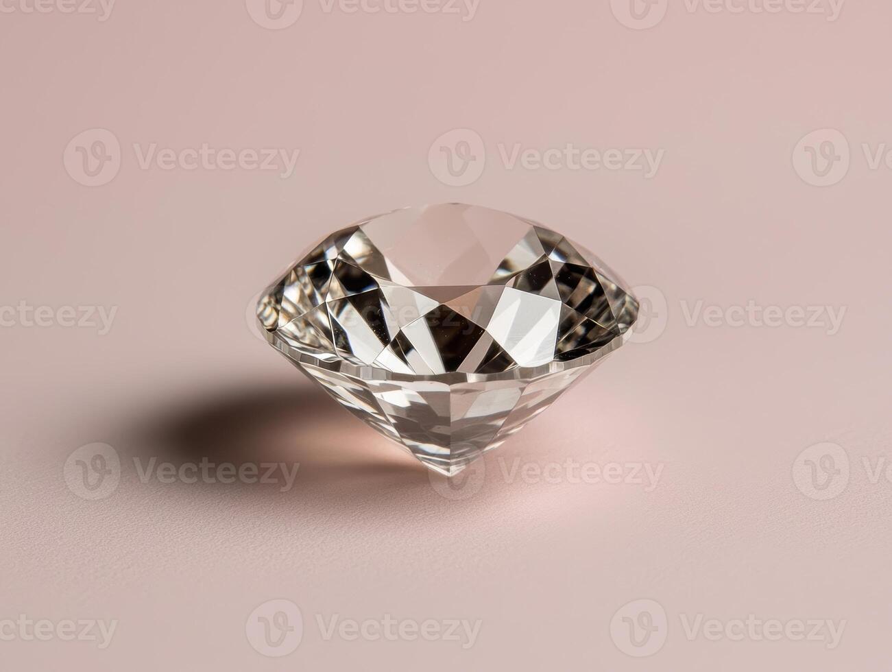 Close up of a sparkling, clear gemstone on a pink background photo