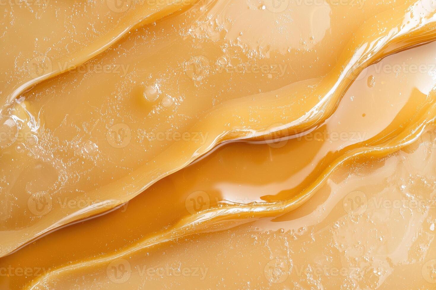Abstract background of golden caramel swirls and texture photo