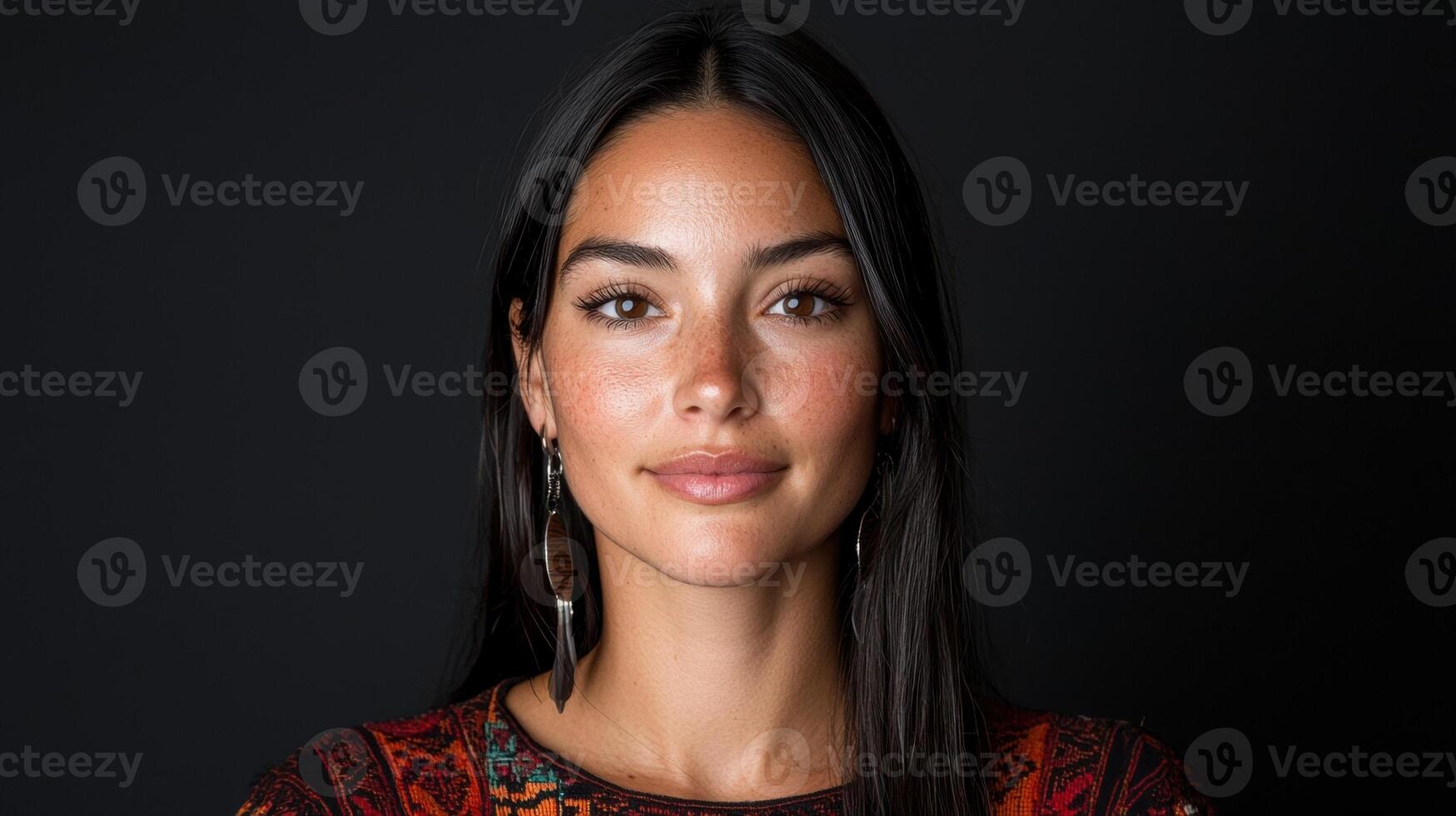 Portrait of a young woman with freckles and long dark hair. photo